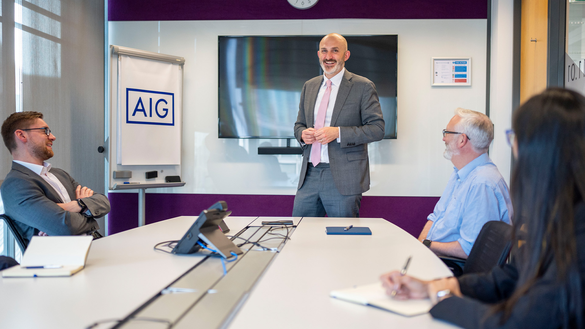 Gordon Browne in a conference room with colleagues