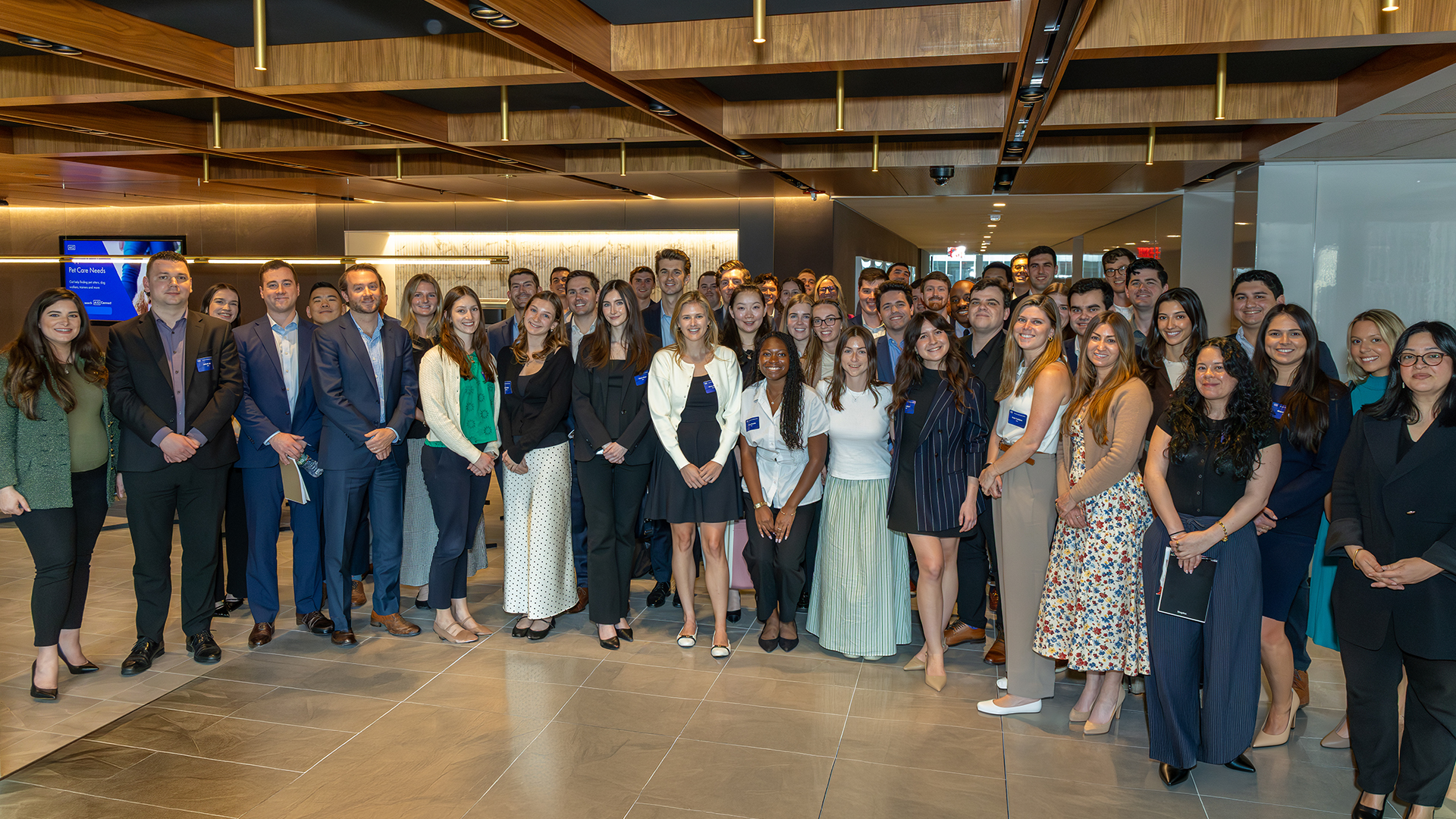 Large group of brokers in their early career gathered at the AIG office